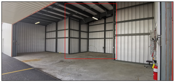 Image shows an airplane hangar.