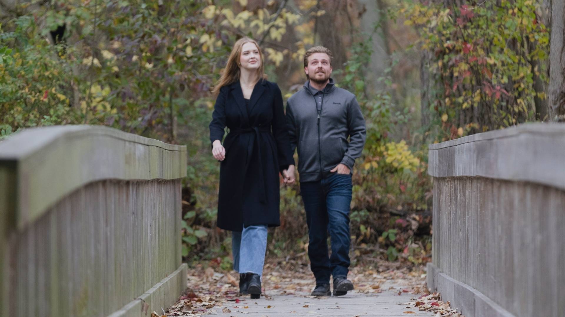 A couple walking along the boardwalk at Holiday Beach Conservation Area