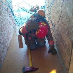 firefighter entangled in wires