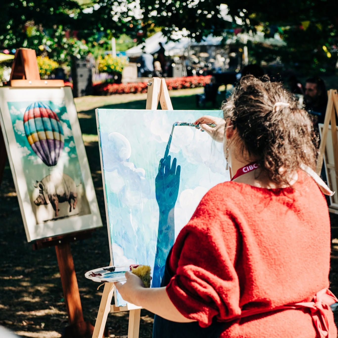 Artist painting at Grand River Arts Festival