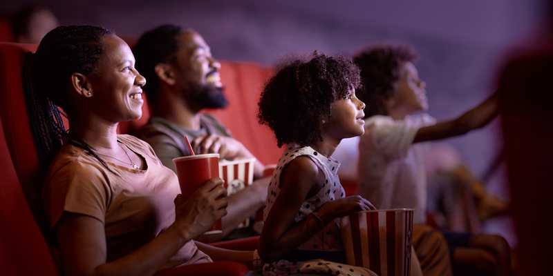 family watching film in theatre