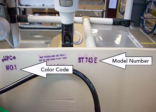 Inside the top of the toilet where the color code and model number can be found.