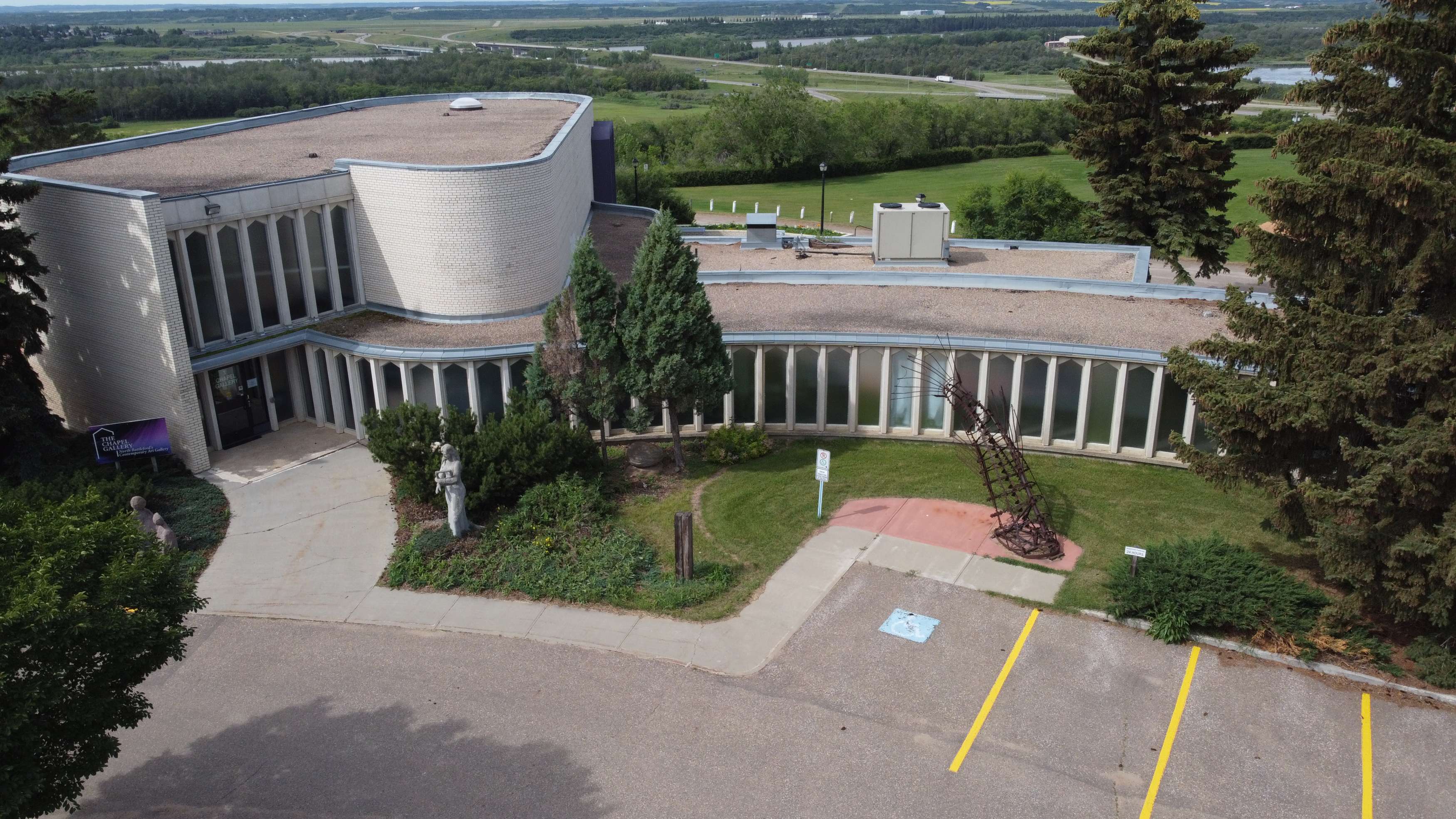 Aerial view of the Chapel Gallery surrounded by greenery and sculptures.