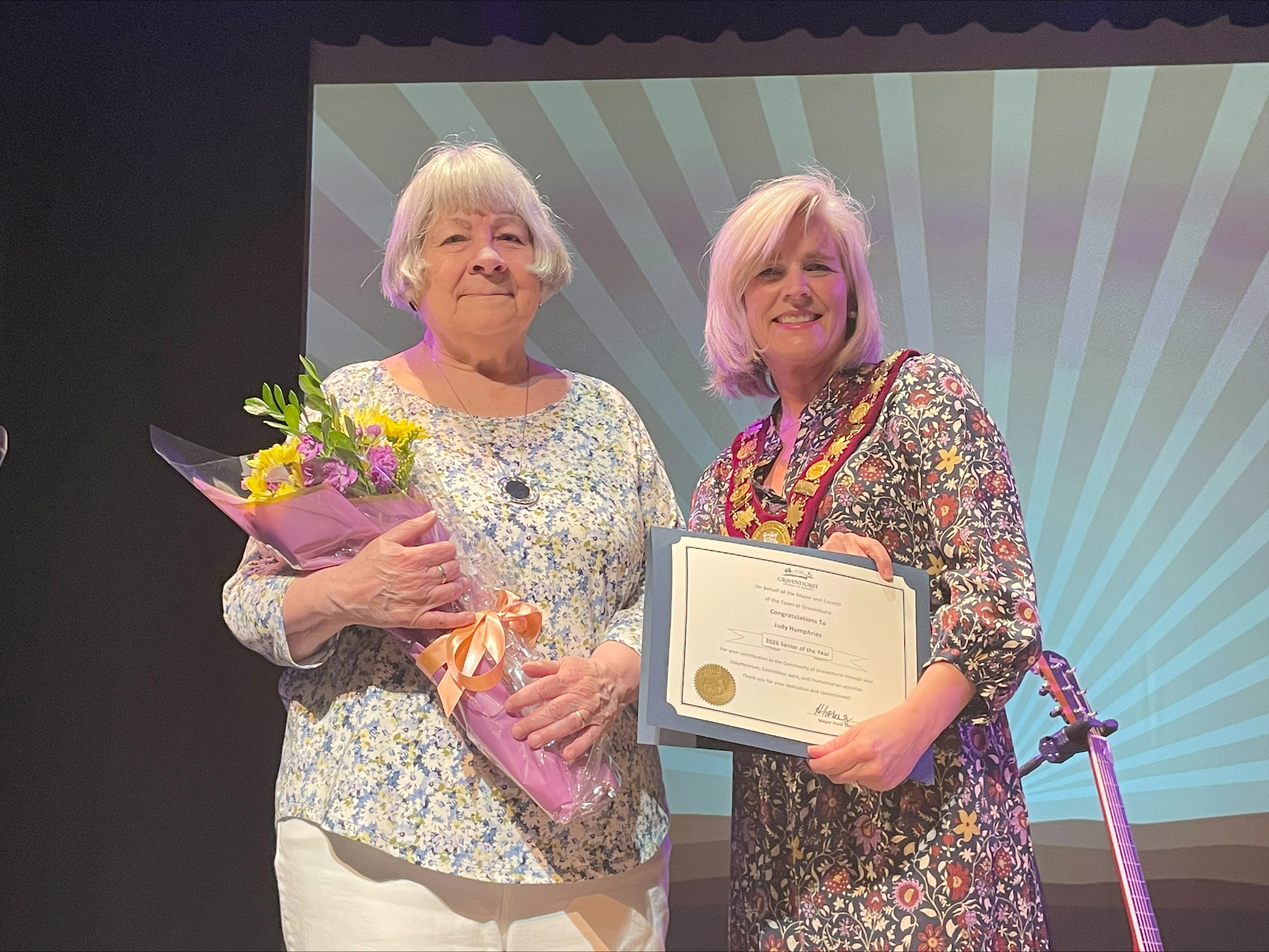 Judy Humphries and Mayor Lorenz on stage at the Gravenhurst Opera House.