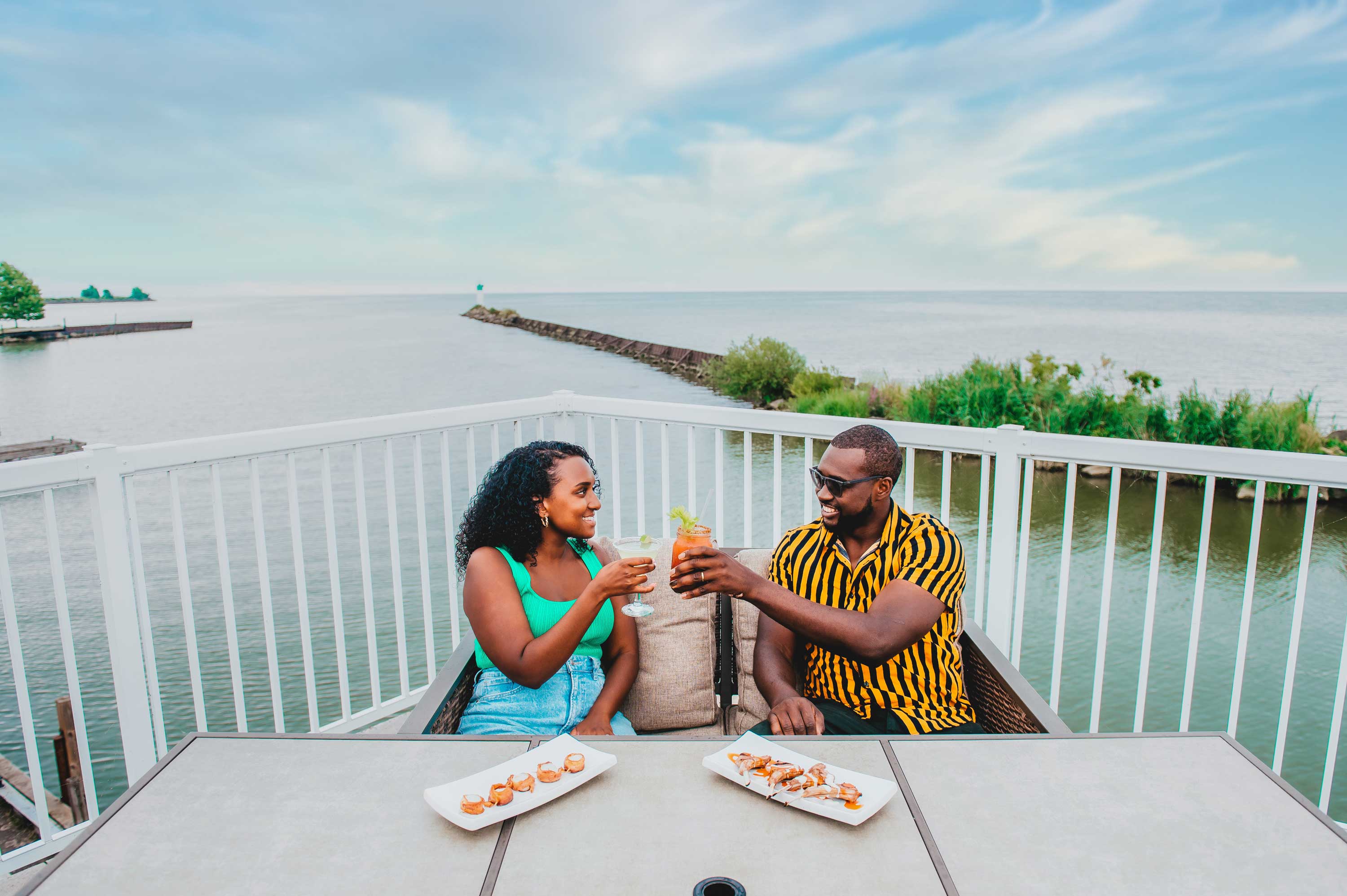 Couple on patio overlooking the water