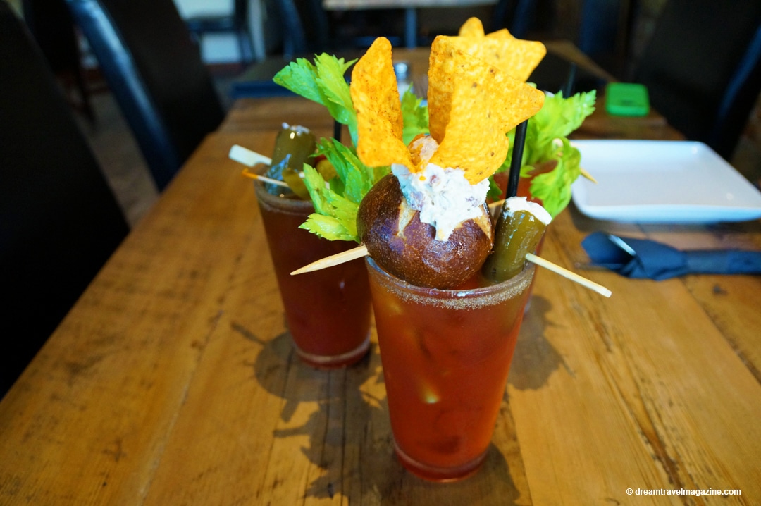 a fancy Caesar beverage with many toppings