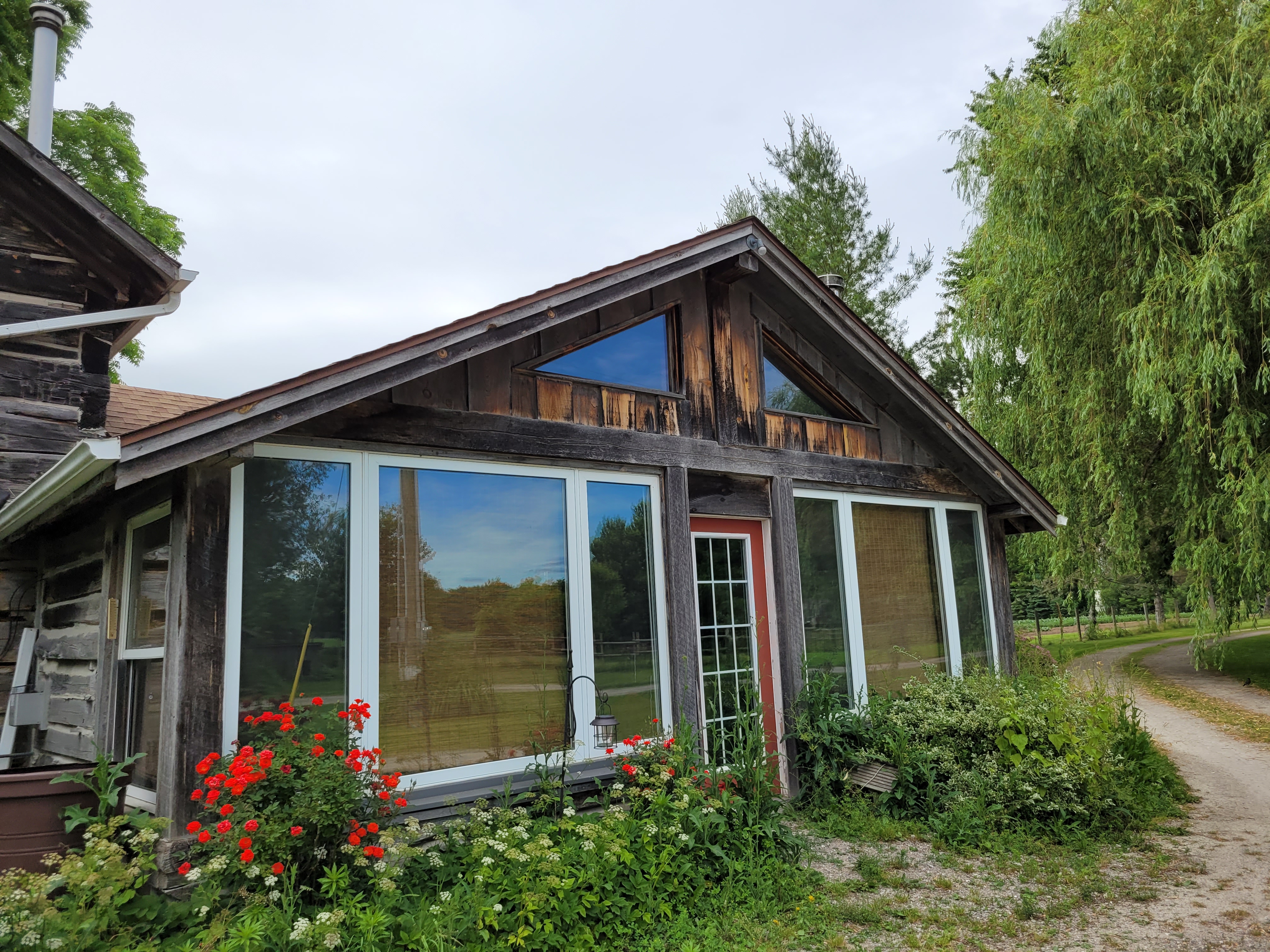 front of a heritage log building