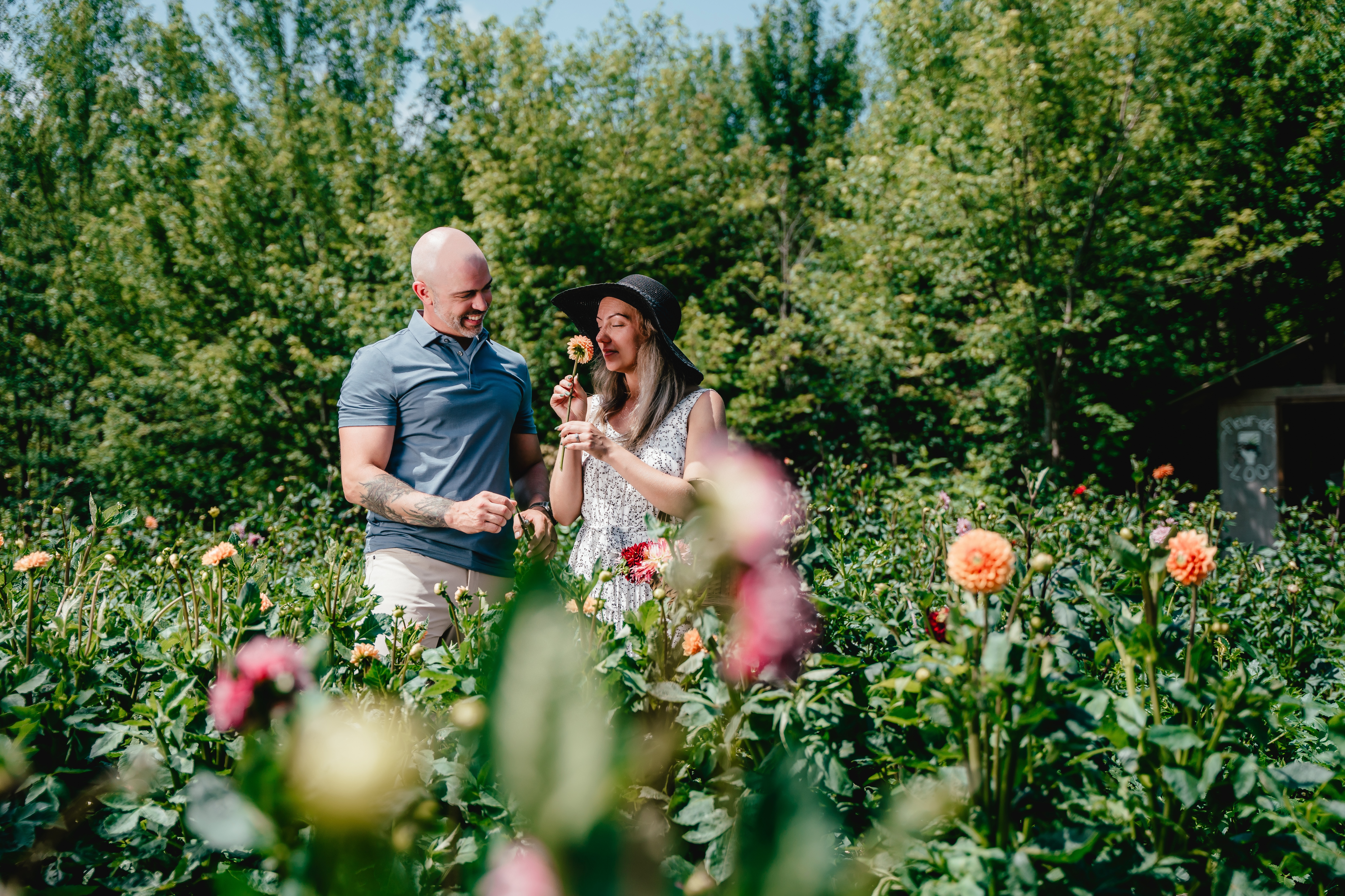 A couple enjoy a field of colourful flowers