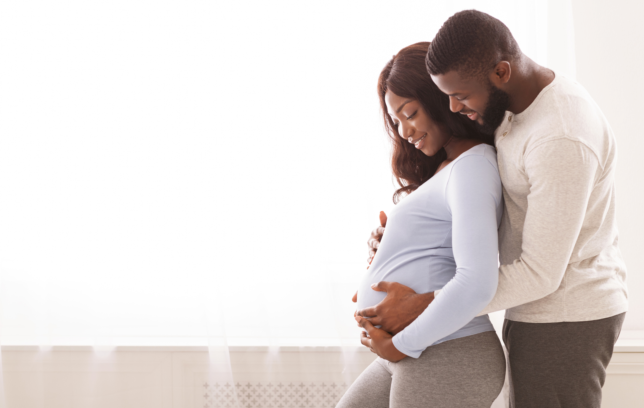 Smiling pregnant mother and father to be.