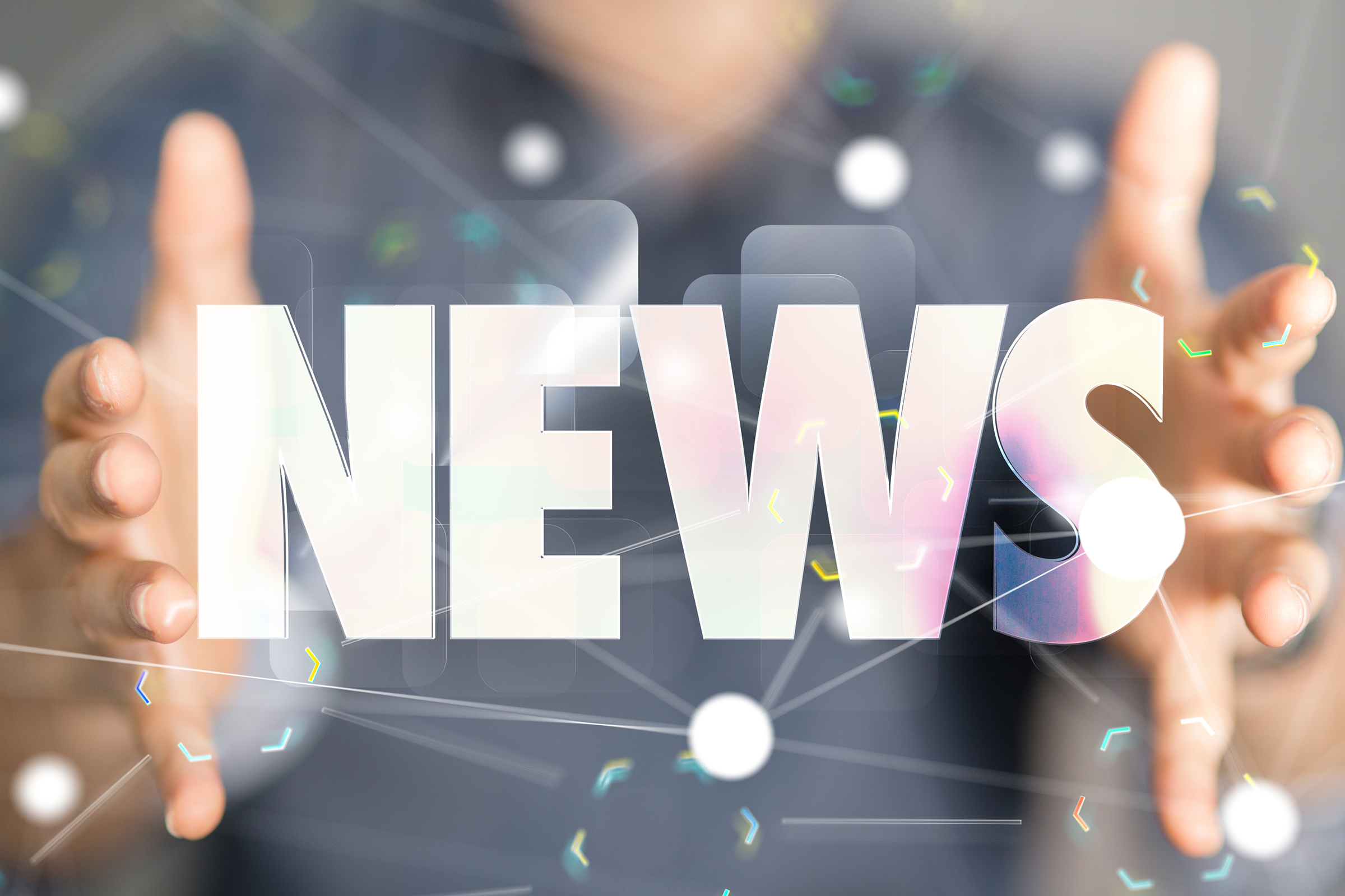Person holding hands apart with the word NEWS between them.