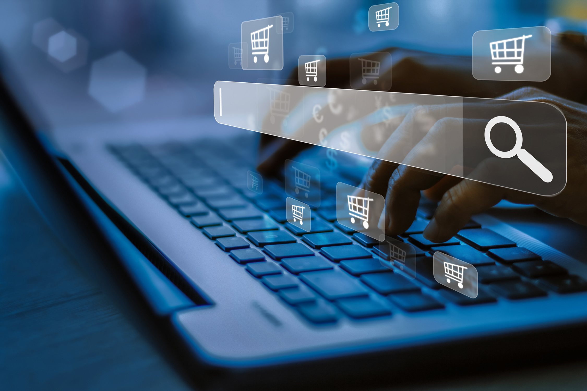 Close up of fingers typing on a laptop