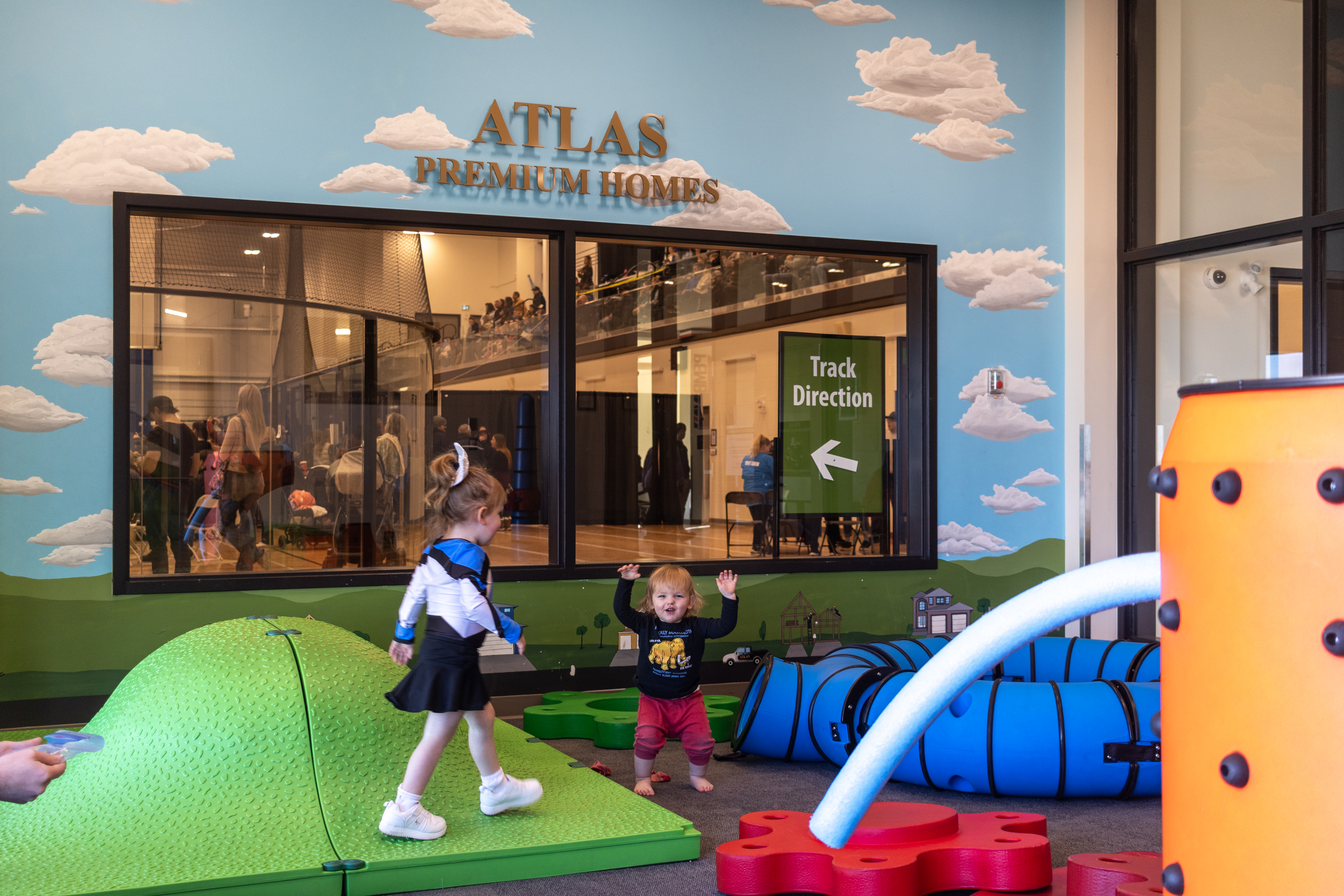 children playing in an indoor play space