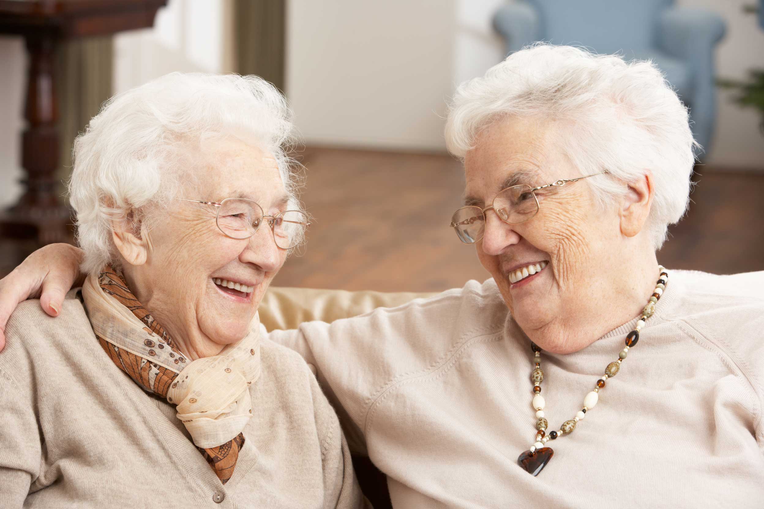 Two senior women enjoying a celebration