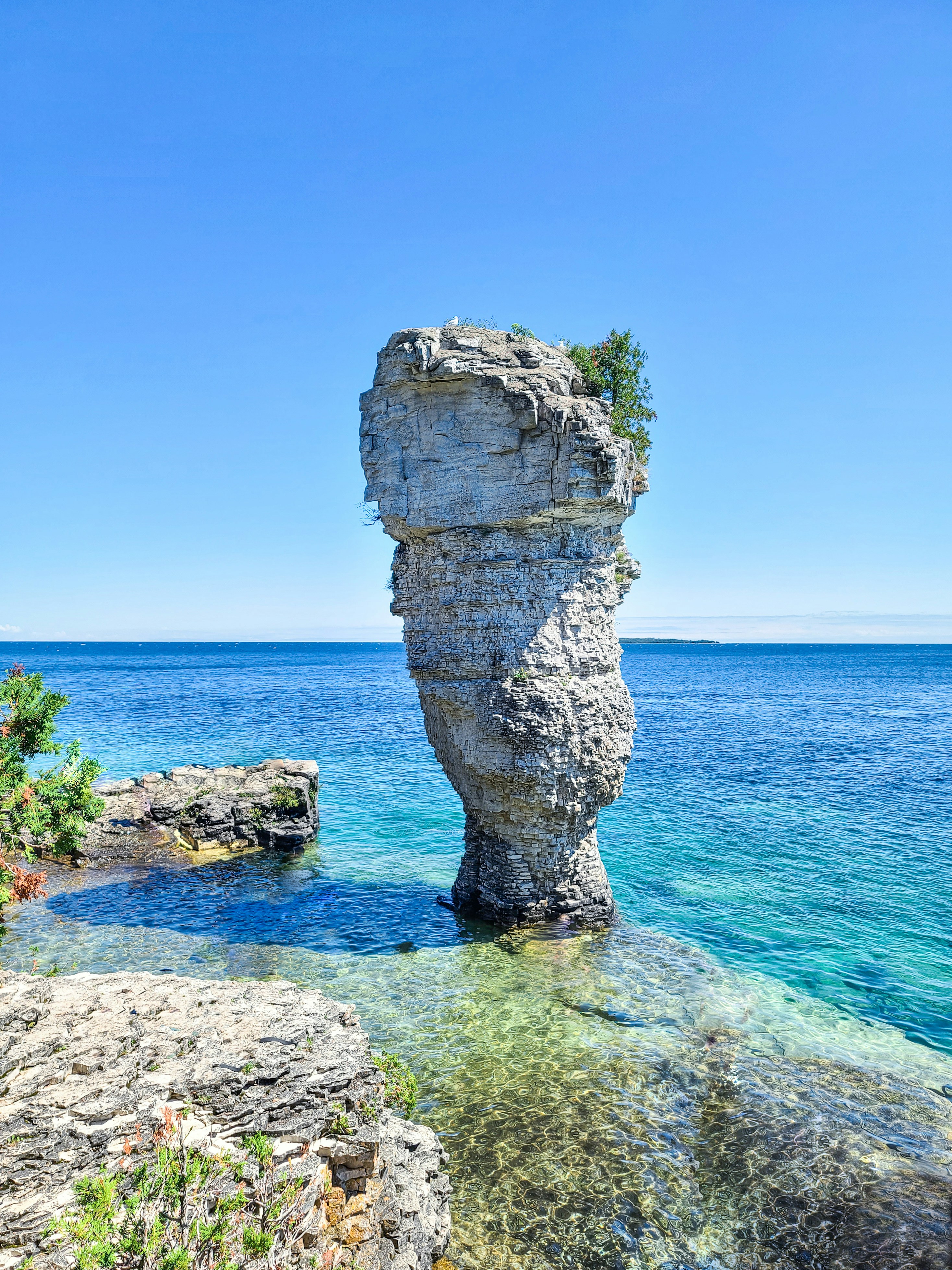 Large rock formation in the shape of a flowerpot located on Flowerpot Island in Tobermory Ontario
