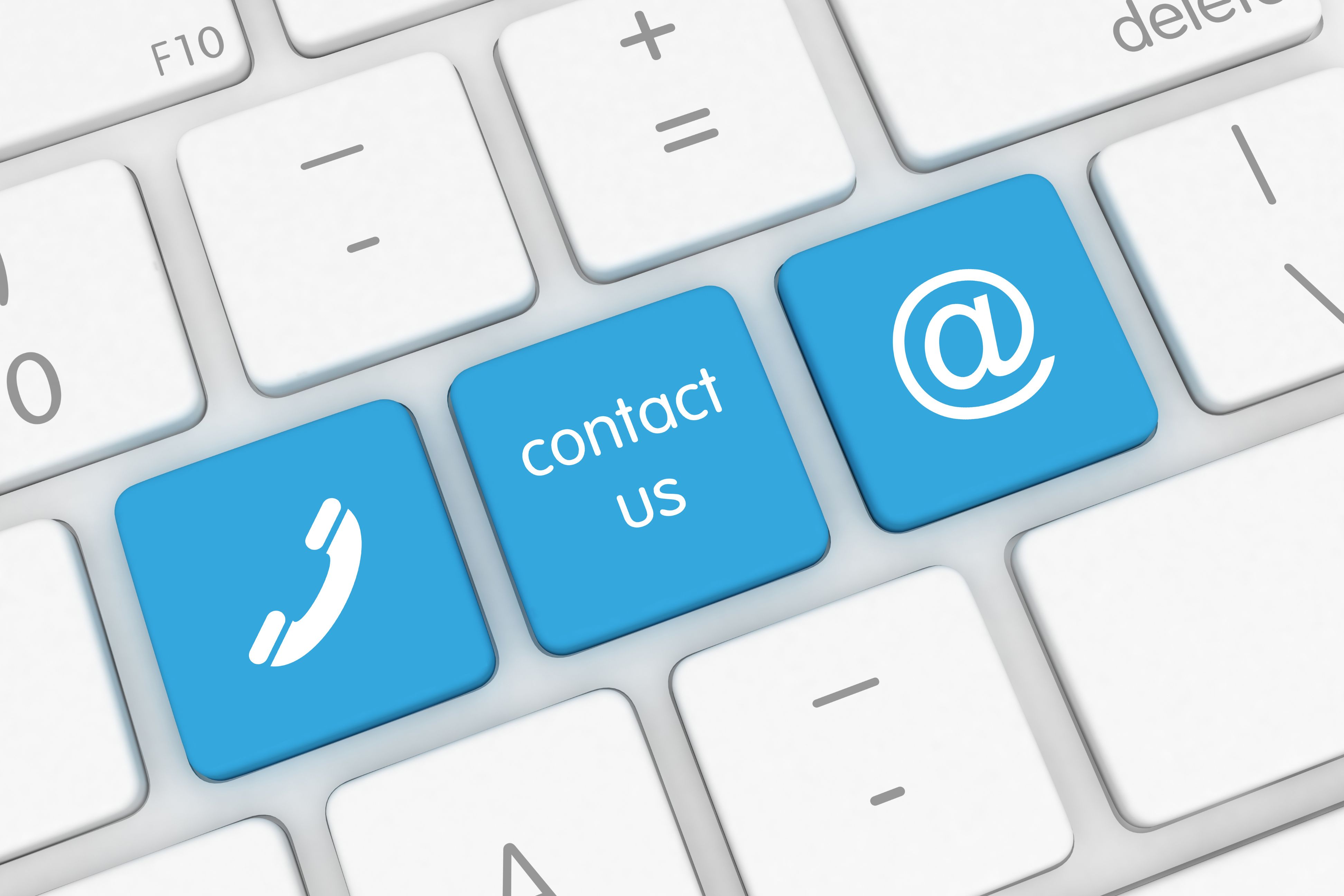 A white keyboard with 3 blue keys. one each for a phone, contact us and @