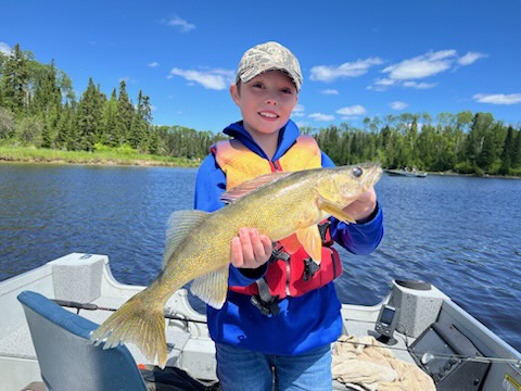 boy holding big fish